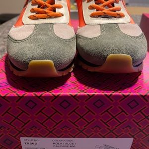 Tory Burch Sneakers . Tried on and fit tight . They are brand new.